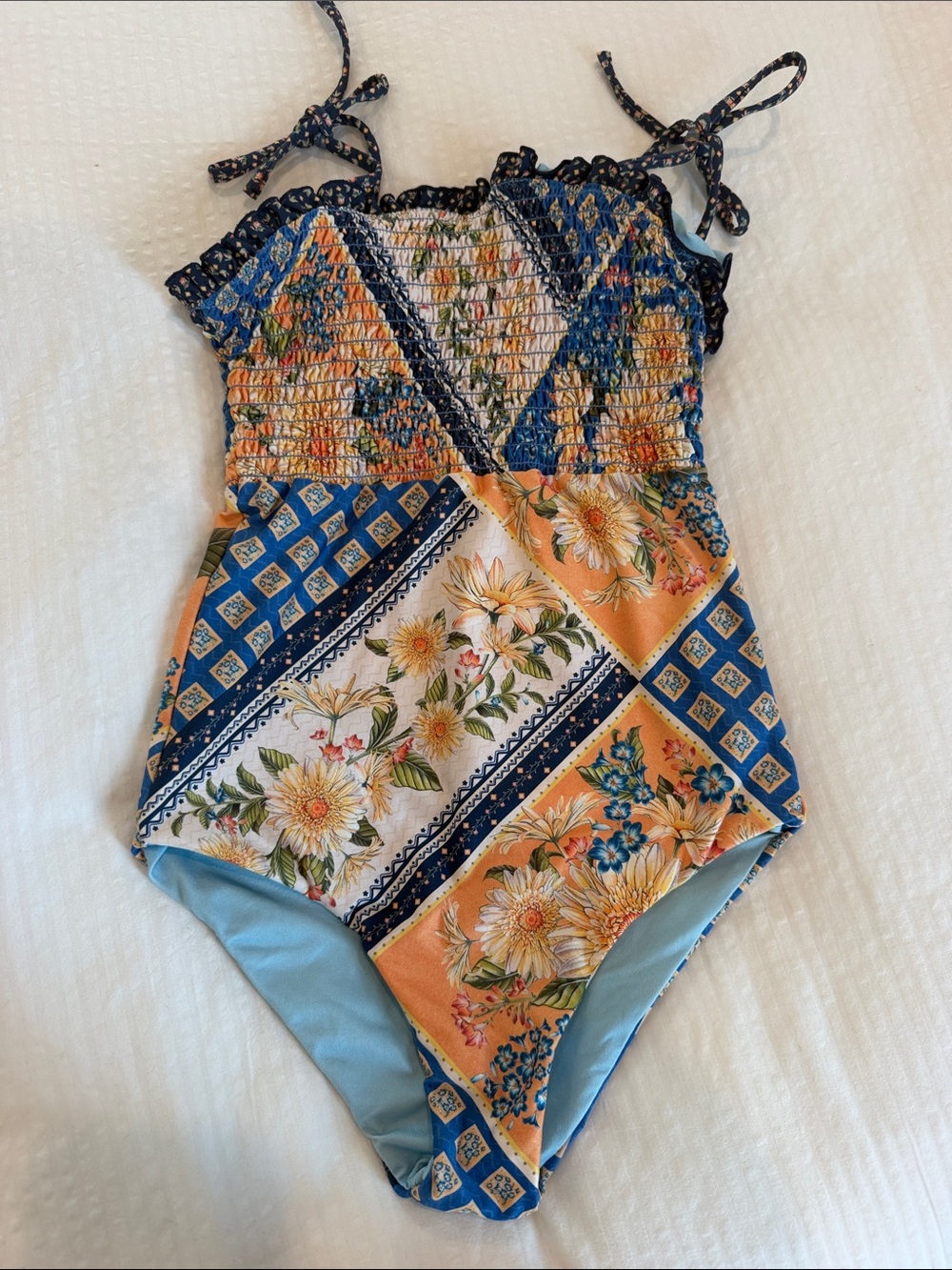 Agua Bendita Girls Floral Patchwork One-Piece Swimsuit in Blue and Orange